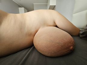 Huge heavy saggy boobs hang below the navel. Macromastia . Sex between boobs and anal sex