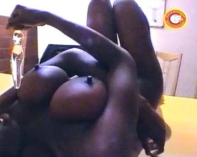 Big boobed German ebony slut fucks herself with dildo